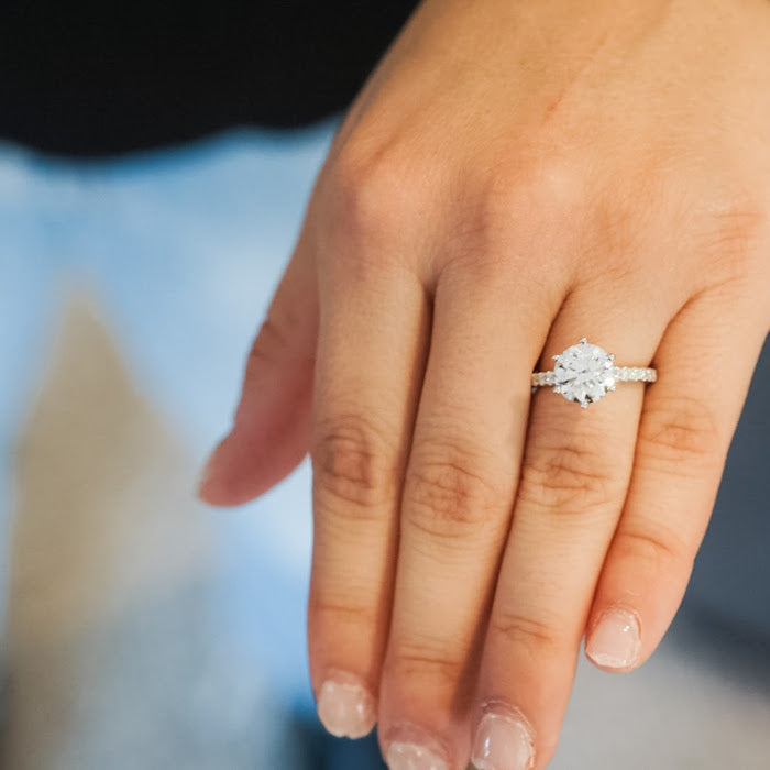 Woman hand wearing a  diamond ring