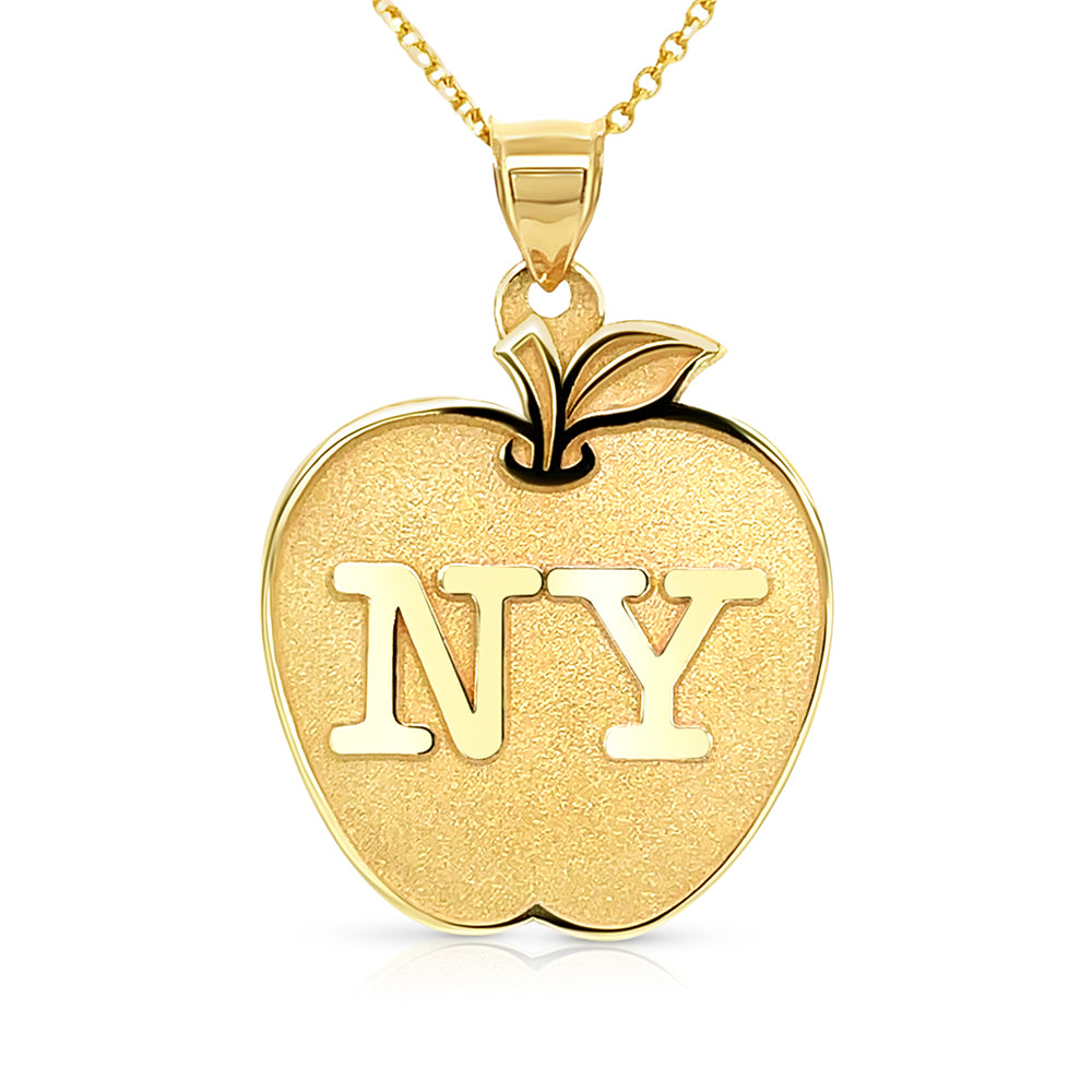 Yellow gold necklace with apple pendant on a white background