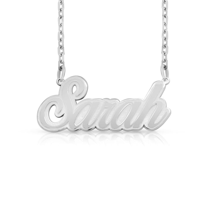 A sample of the nameplate with the name Sarah in White Gold