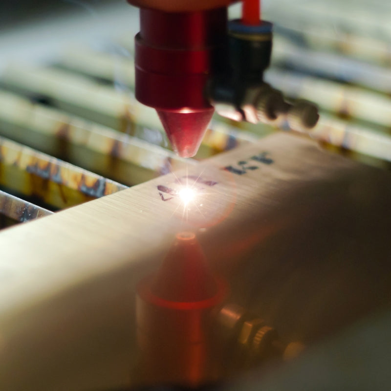 An image showing a laser engraving being done